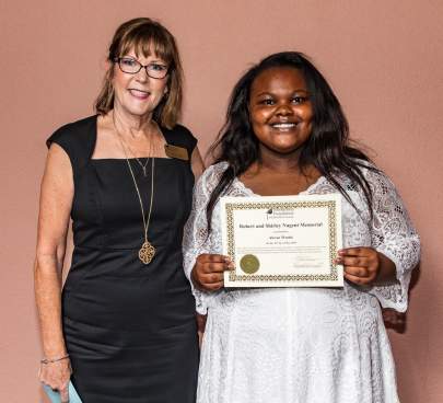 Joan Cook presents Nugent Award to Alexus Wood